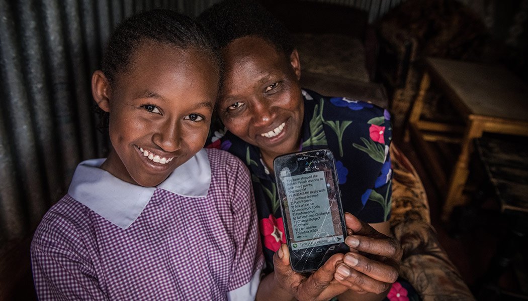Imelda Mumbi and her mother with-Eneza's educational technology