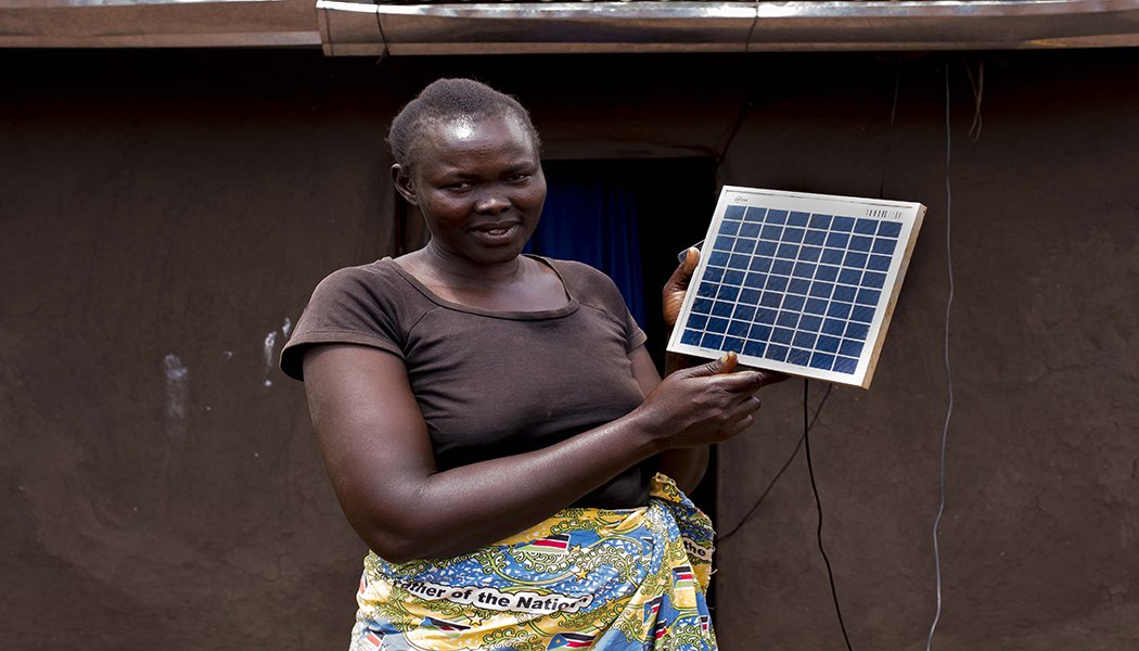 Refugee Rose Ben Aya with her solar panel