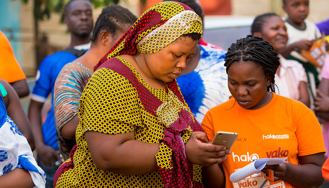 A client in Tanzania uses a mobile savings account, which is just one of the innovations in banking that FINCA provides.