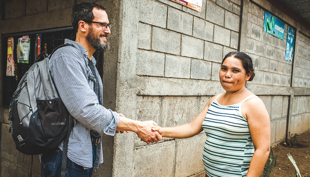Bob Price meets with Estela Amparo Sanchez Guerro in Nicaragua after traversing dirt roads.