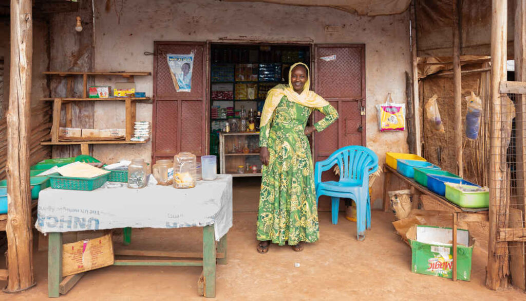 Hayat Abdul Karim Majid outside her grocery store in the Kiryandongo refugee settlement in Uganda.