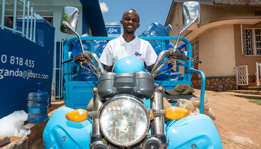 Nonprofit photography captures Jibu driver, Ramathan's, pride in his delivery vehicle.